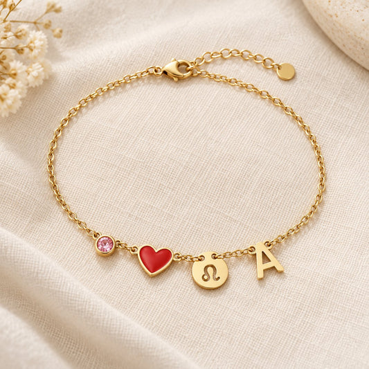 Bracelet Olianne doré à plat : pierre de naissance, cœur rouge en émail, médaille du signe Lion et initiale A